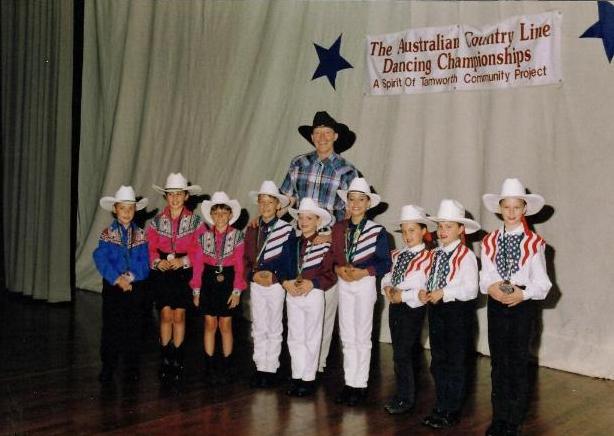 Bill Bader Presenting the Junior Trio Champions of the Australian Line Dance Championships 1998